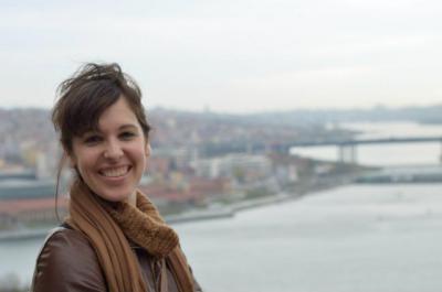 Danielle Schoon - Smiling woman with body of water in background