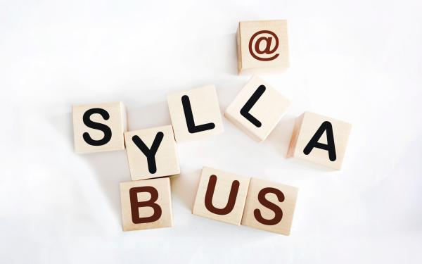 Wooden blocks arranged to spell "@ syllabus"